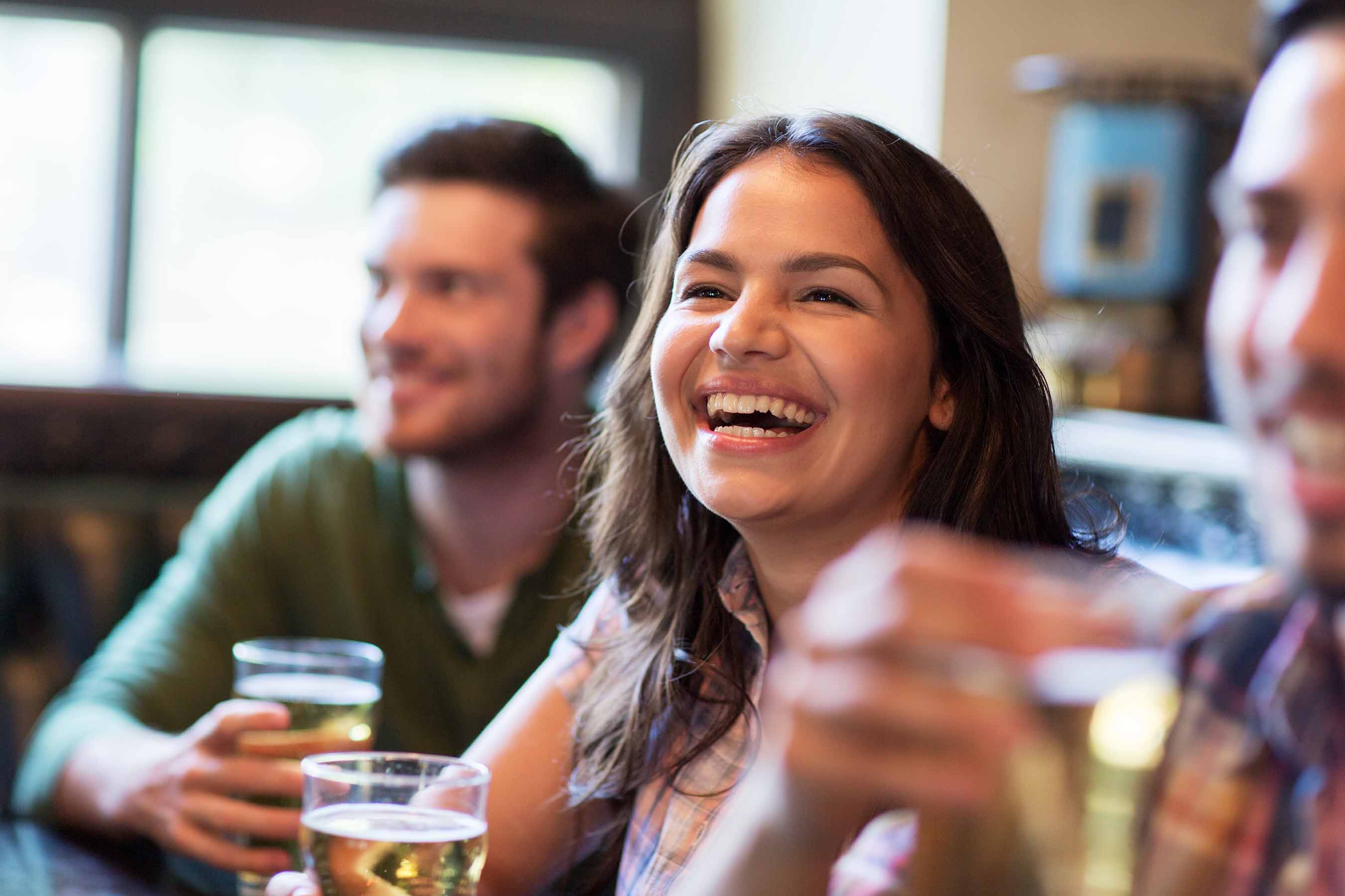 People laughing and drinking